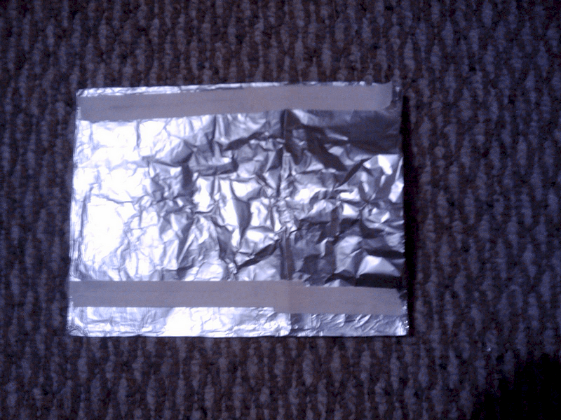 sides of aluminum foil folded