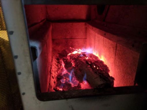 log burning inside fireplace