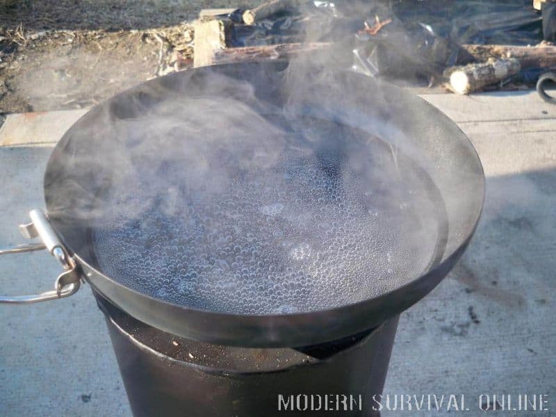 water simering on camping stove