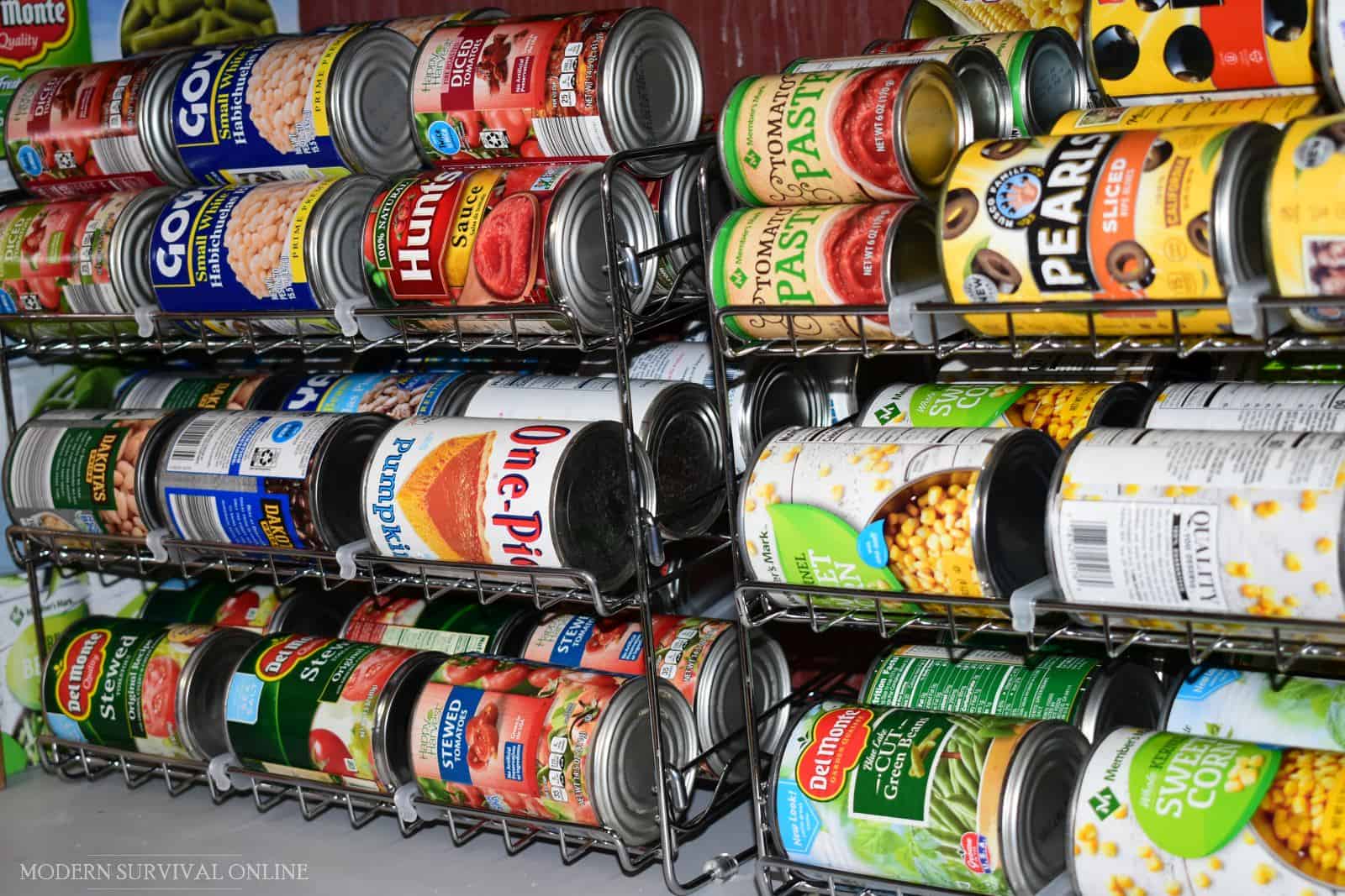 canned foods on can racks in pantry