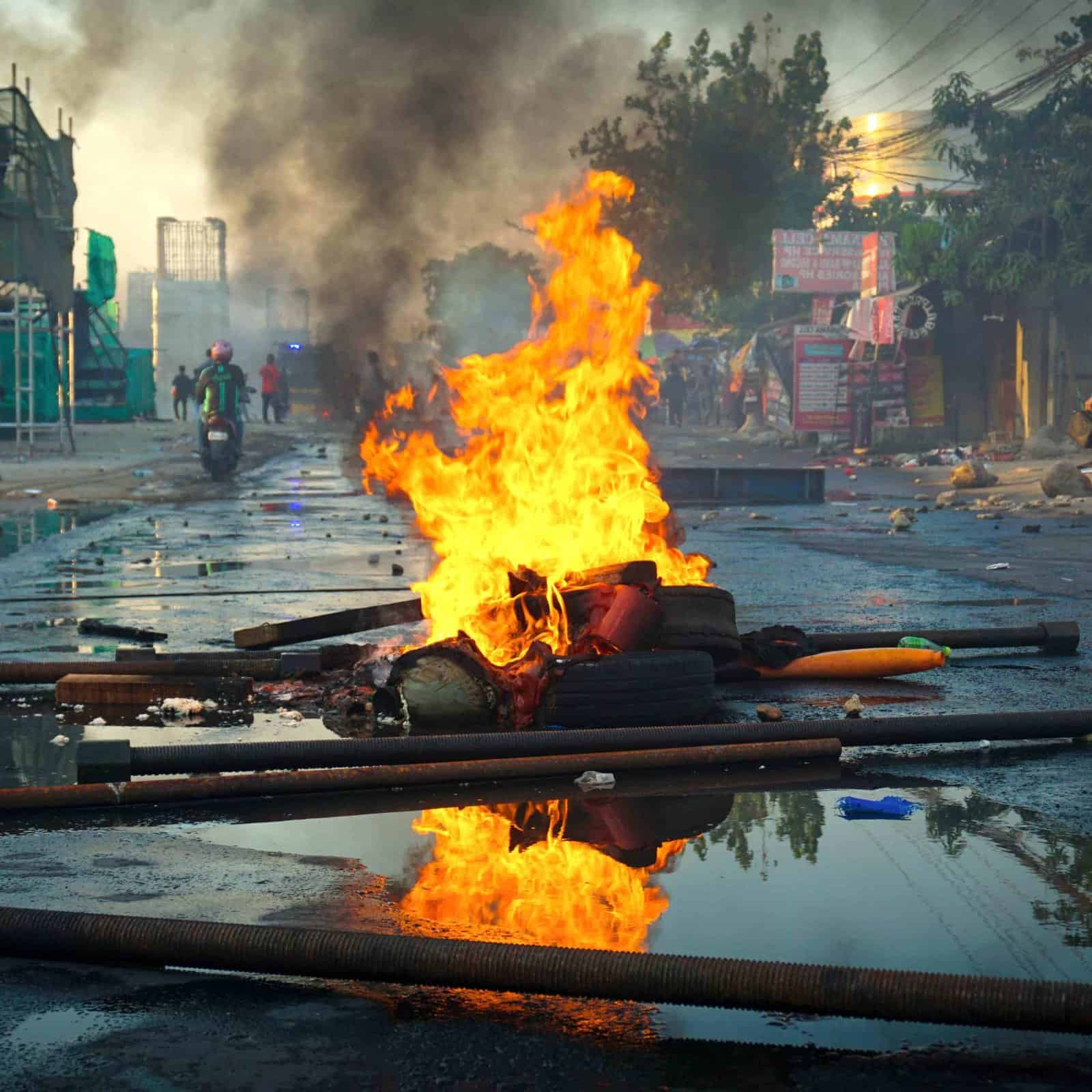 burning tires in riot aftermath