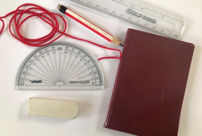 red string, ruler, pencil, notebook, protractor