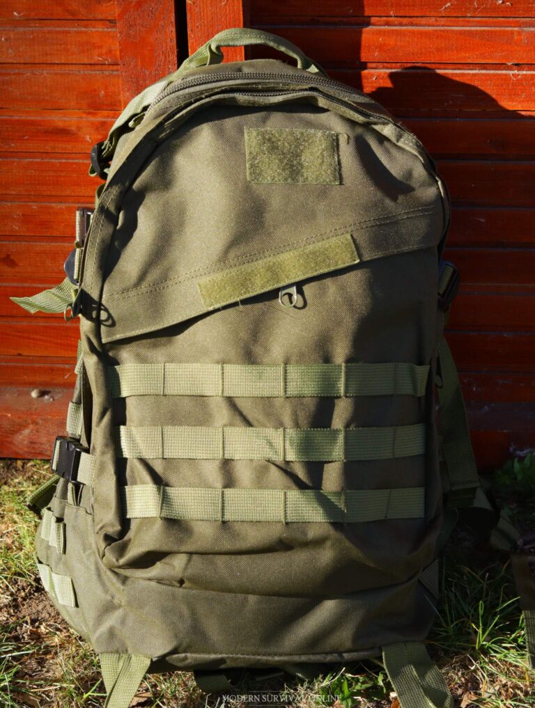 a green MOLLE backpack