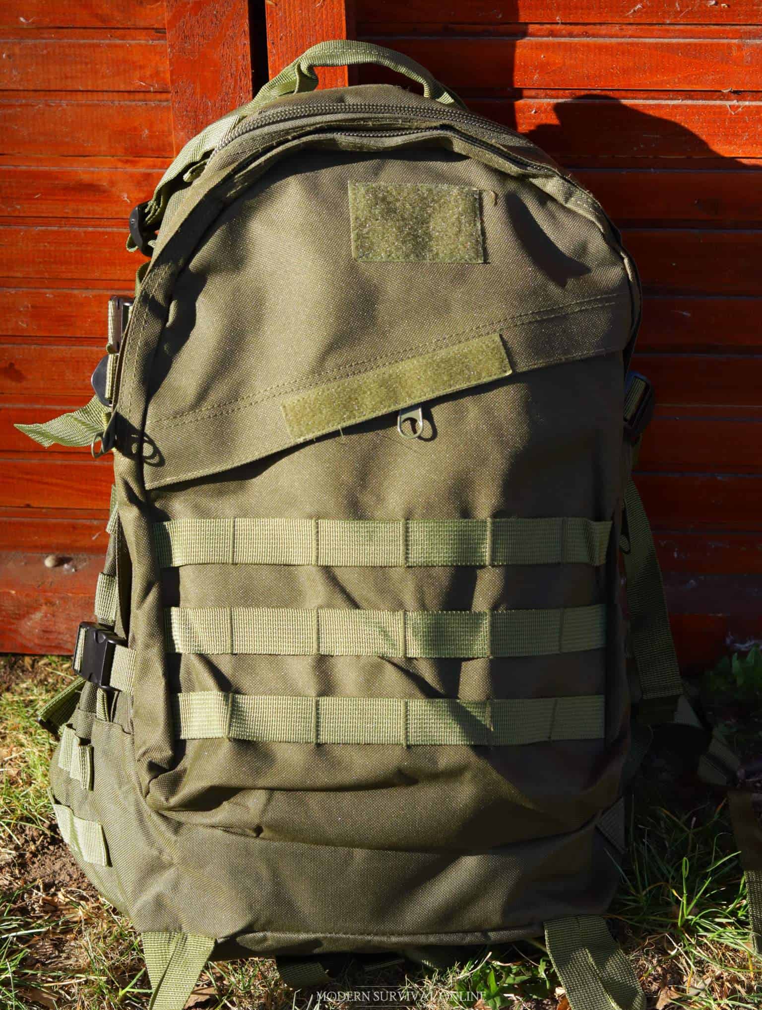 a green MOLLE backpack