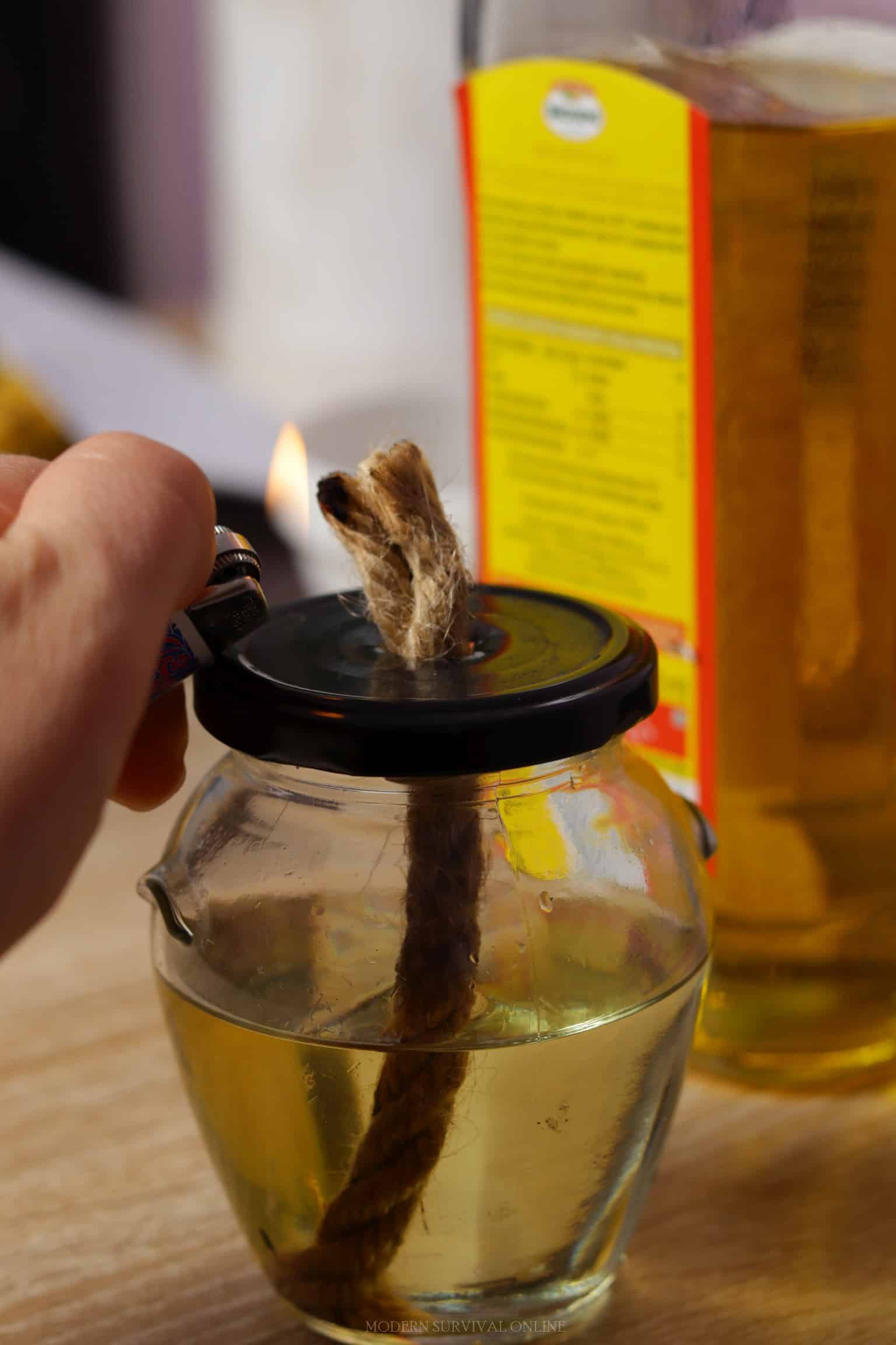 lighting a DIY lamp running on cooking oil