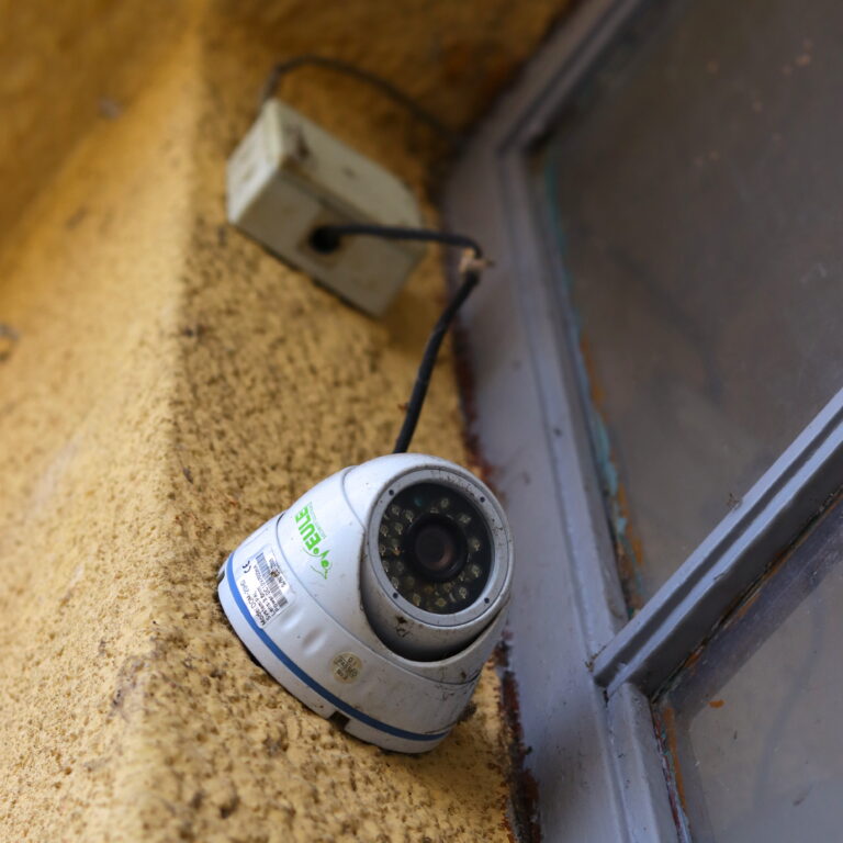 security camera mounted on exterior house wall