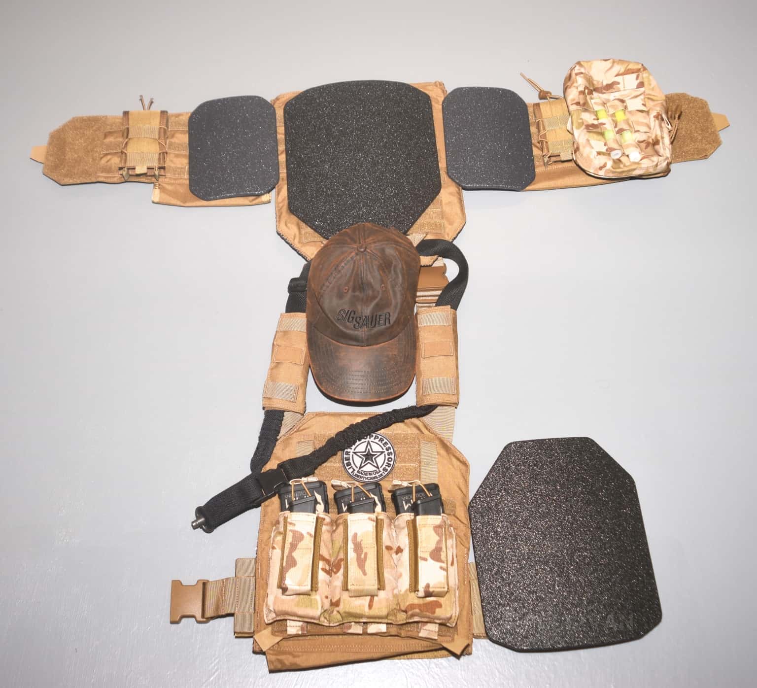 a brown plate carrier with plates