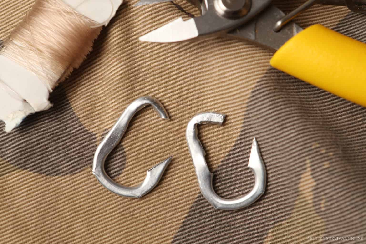 two DIY fishing hooks made from soda can tabs