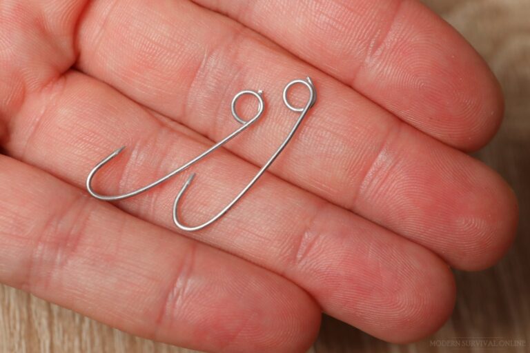 two safety pin hooks in hand